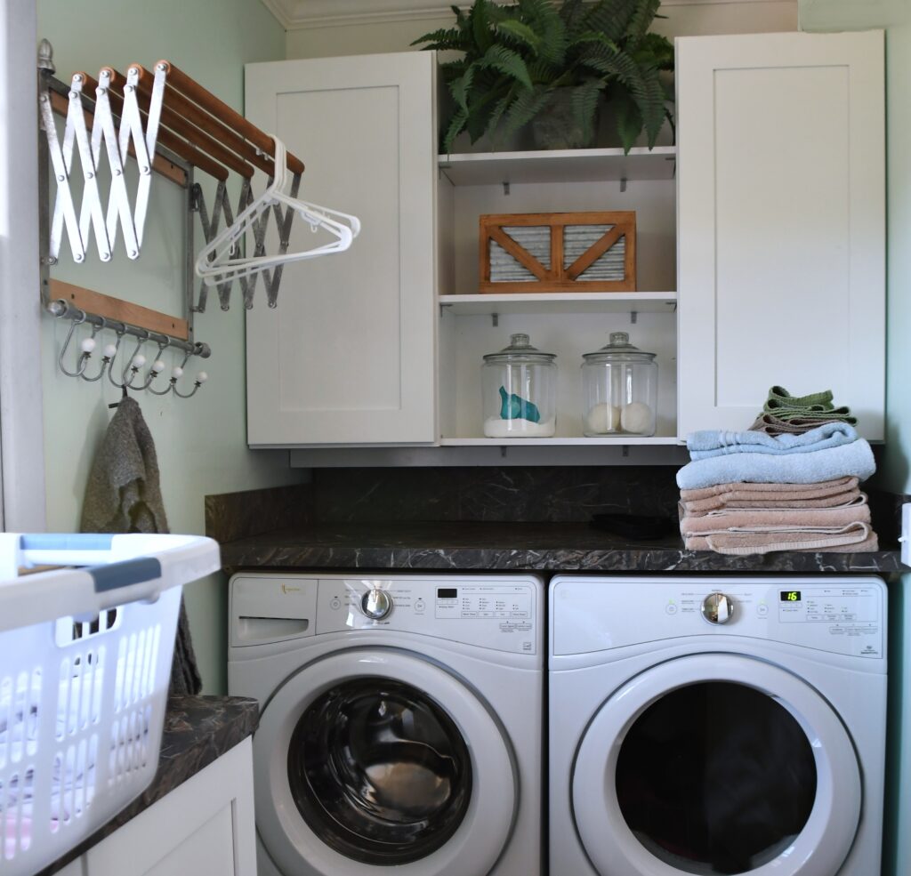 Bathroom-laundry combo solutions: pegboard, rail systems, Lazy Susan storage. 